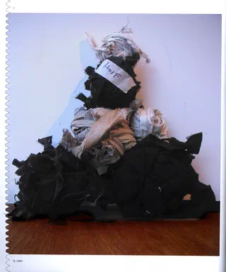 Textile Designers at the Cutting Edge, page 70: photograph of a heap of rolled fabric offcuts on a wood floor, a bundle labeled Hose in handwriting