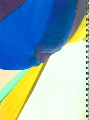 Thoughts Play Hide & Seek, page 176: a close-up photograph of the hanging textile installation, overlapping folds of blue, purple, yellow and teal fabric against a pale ceiling