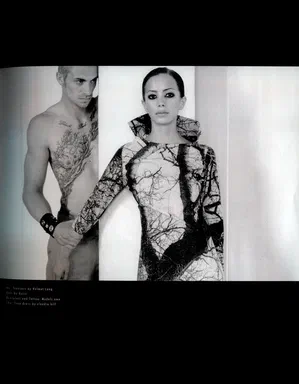 ahead, Winter 2004/05, page 21: black-and-white photograph from the same story, a shirtless tattooed man beside a woman in a branch-print dress by Claudia Hill, against a white pillar