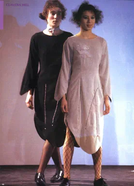 gap Press Prêt-à-Porter, Autumn/Winter 2001/2002, page 166: full-page color runway photograph of two models in draped dresses, one black with a white bow choker, one cream, both in fishnet tights